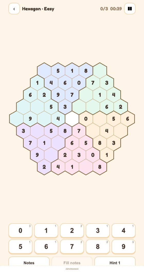 Hexagoku — a hexagonal Sudoku board with coloured regions and a 0-9 number pad